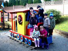 Kids playing at a playground during our daycare in Coquitlam